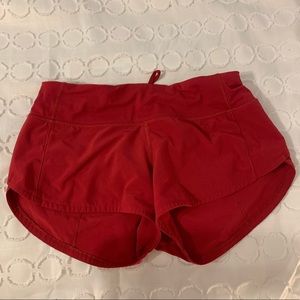 red Lululemon shorts, size 2